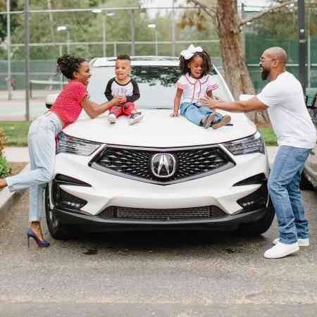Shanola and Daren with their car, Acura MDX automobile. Image Source: Instagram