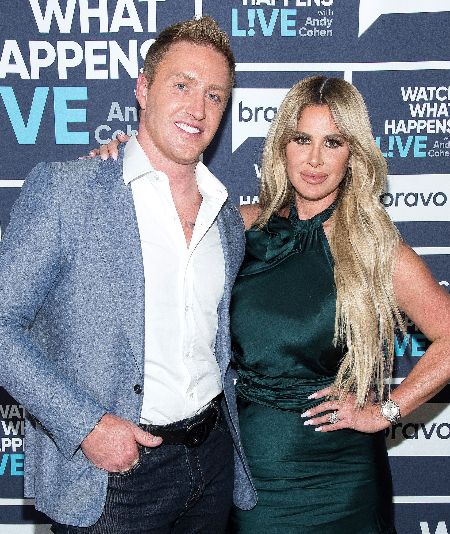 CAPTION: Kim Zolciak and her second husband Kroy Biermann; they married in 2011 & shares 4 children together