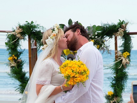 Lawrence Faulborn kissing his bride, FamousFix