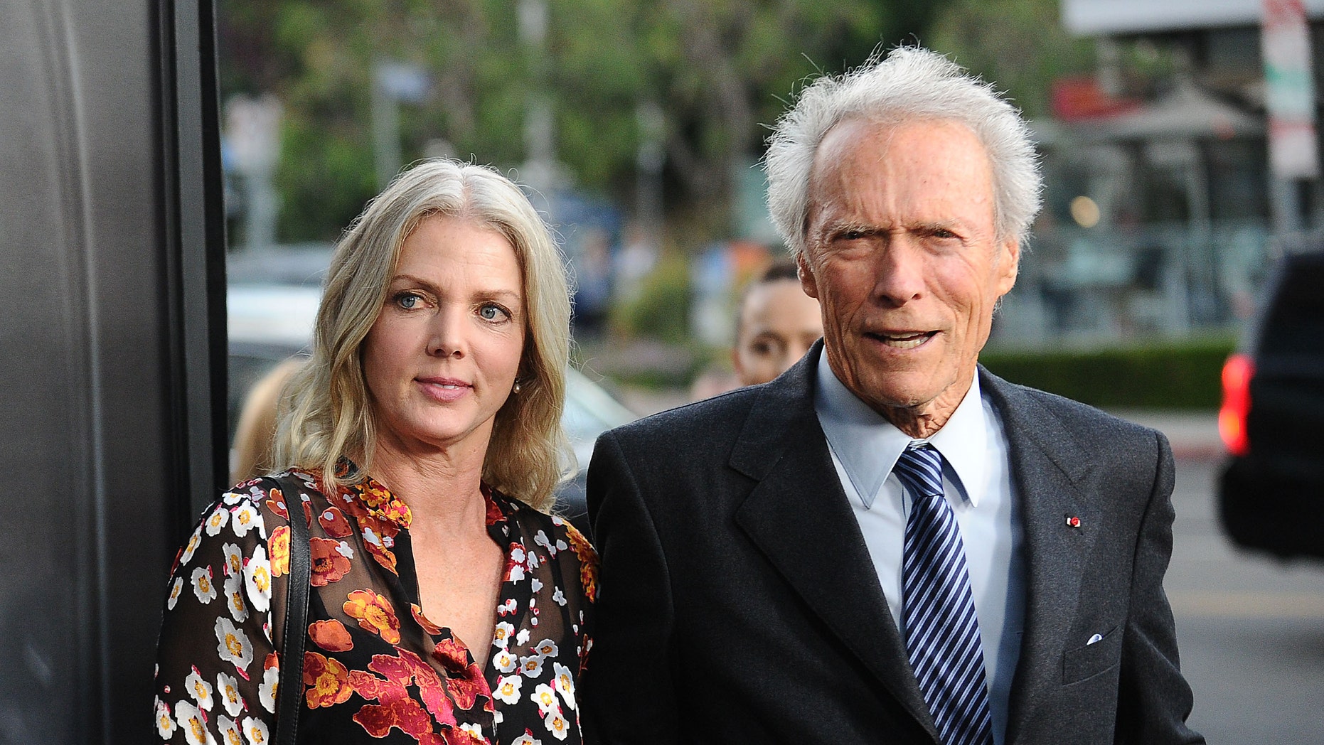 Director Clint Eastwood and girlfriend Christina Sandera  ( Source: Jason LaVeris/FilmMagic)