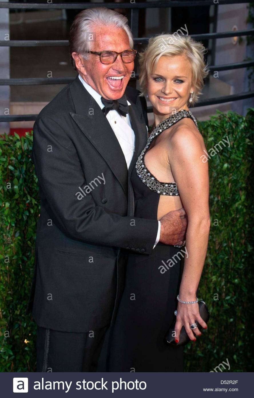 US actor George Hamilton and his partner Barbara Sturm arrive at the Vanity Fair Oscar Party at Sunset Tower in Los Angeles, USA, 07 March 2010. Photo: Hubert Boesl Stock Photo - Alamy Alamy US actor George Hamilton and his partner Barbara Sturm arrive at the Vanity Fair Oscar Party at Sunset Tower in Los Angeles,