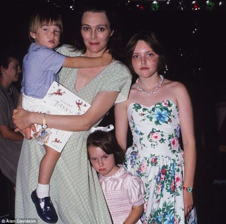 Tessa Dahl carrying her son, Ned Donovan and her daughters