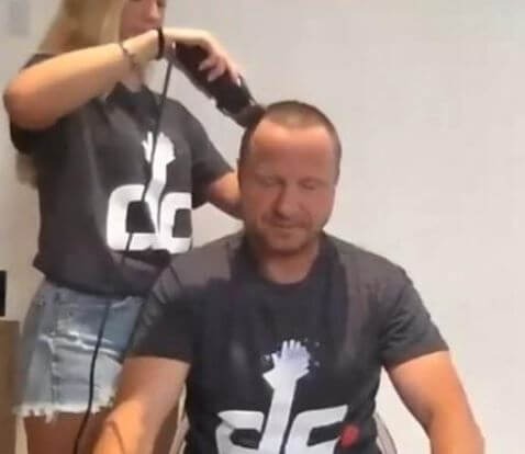 Lexi Brooks shaving her father Scott Brooks hair after the donation was raised. Source: YouTube