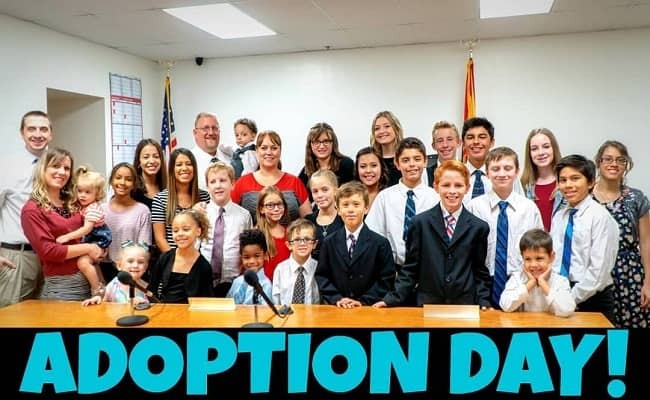 Spencer Wallace with his whole family on the day of adopting Brinley and Trey. Source: Youtube