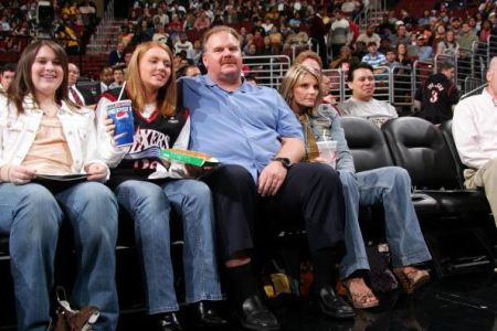 Tammy, her husband, Andy, and their daughters watching the game.